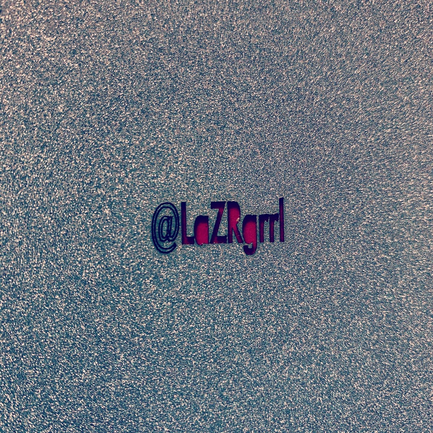 back of glitter cardstock Christmas card with laser cut LaZRgrrl logo